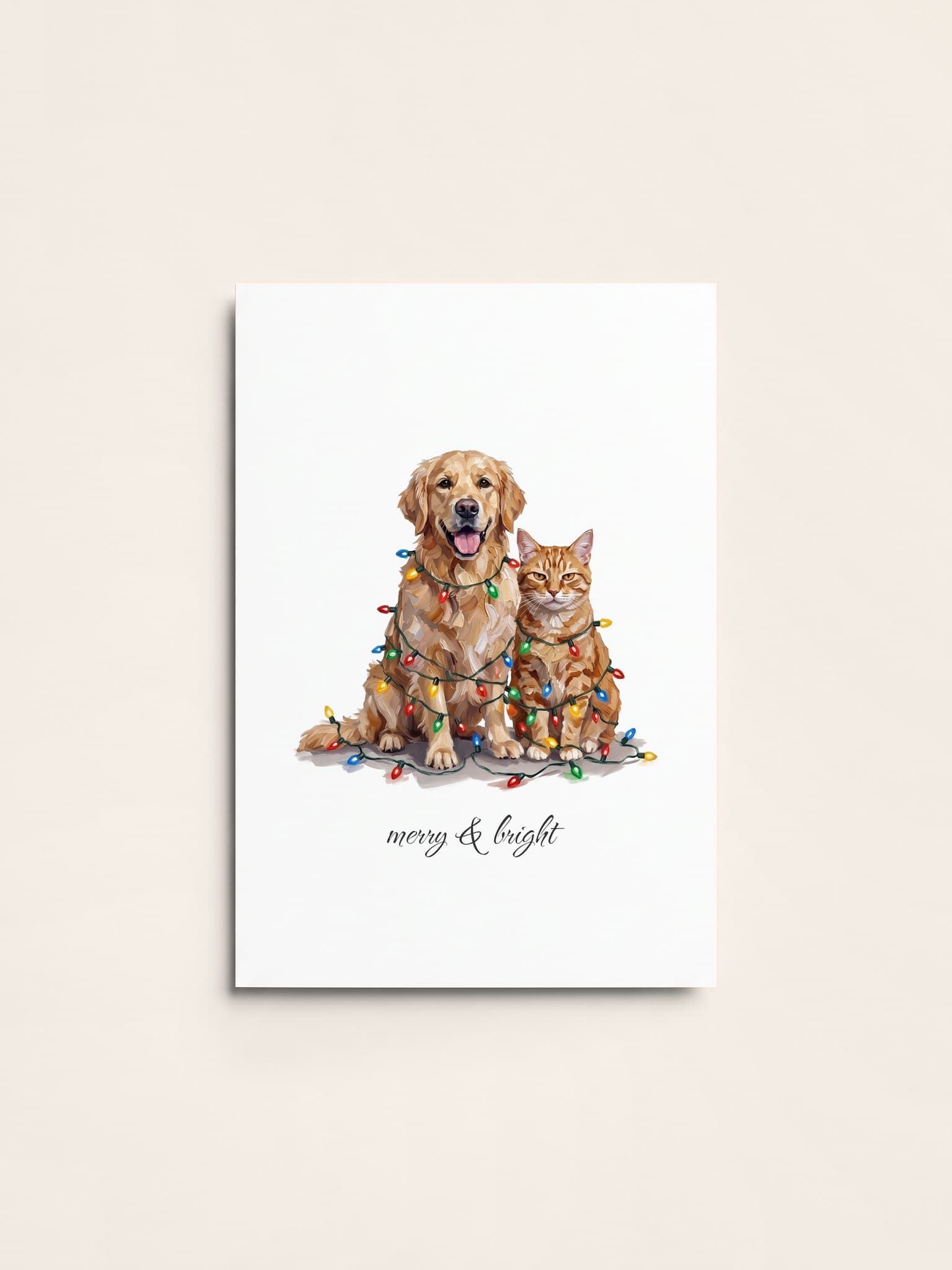 A Christmas card with a golden retriever and a ginger cat tangled in coloured Christmas lights