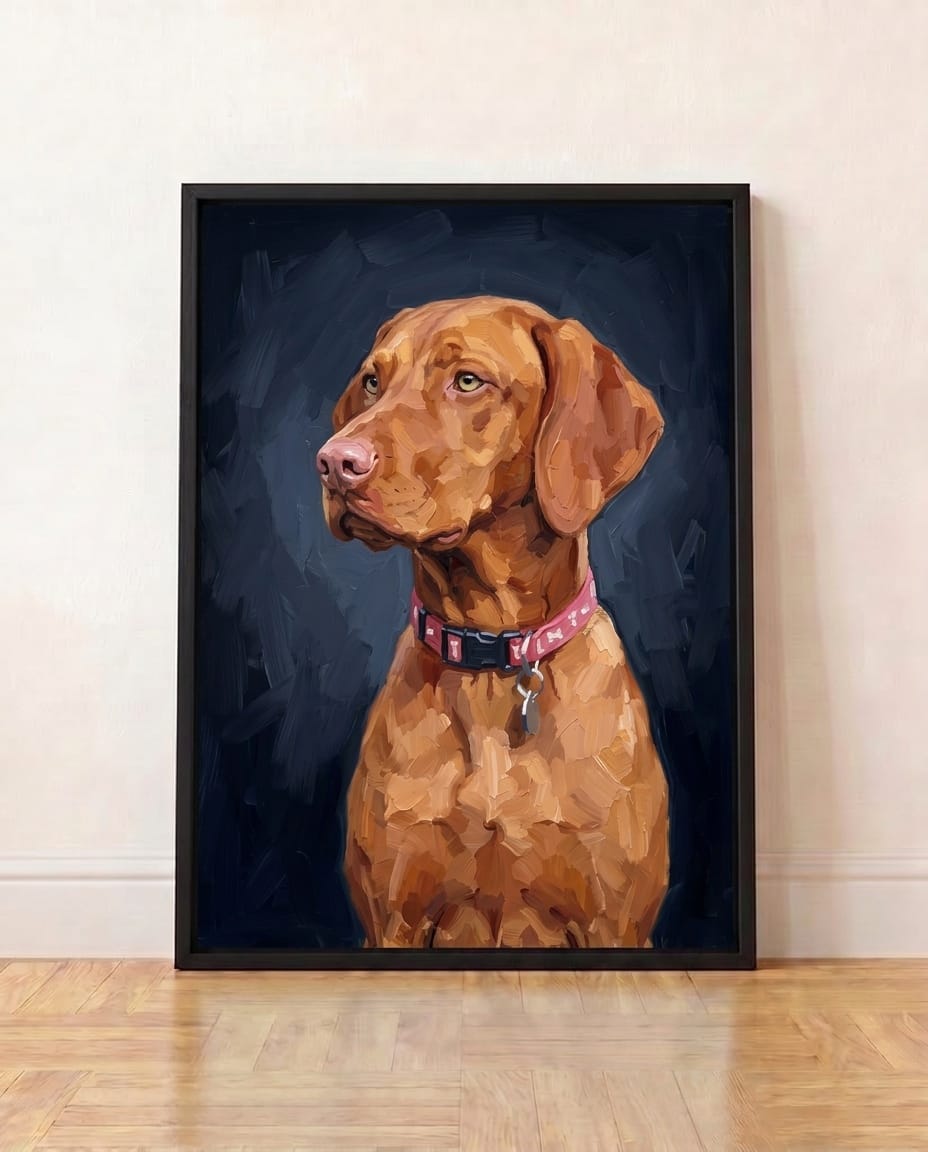 A vizsla painted on a midnight navy background, in a black frame leaning against a wall