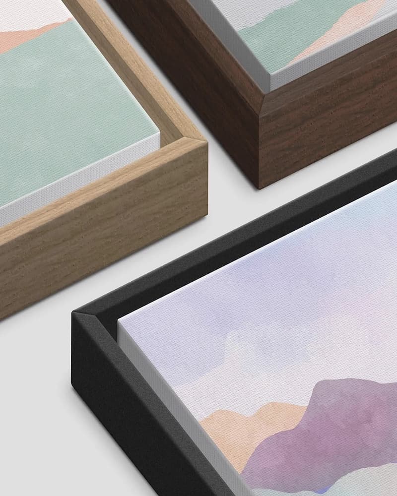 Three canvas float frame corners in natural wood, dark walnut and black, each showing the gap between canvas and frame