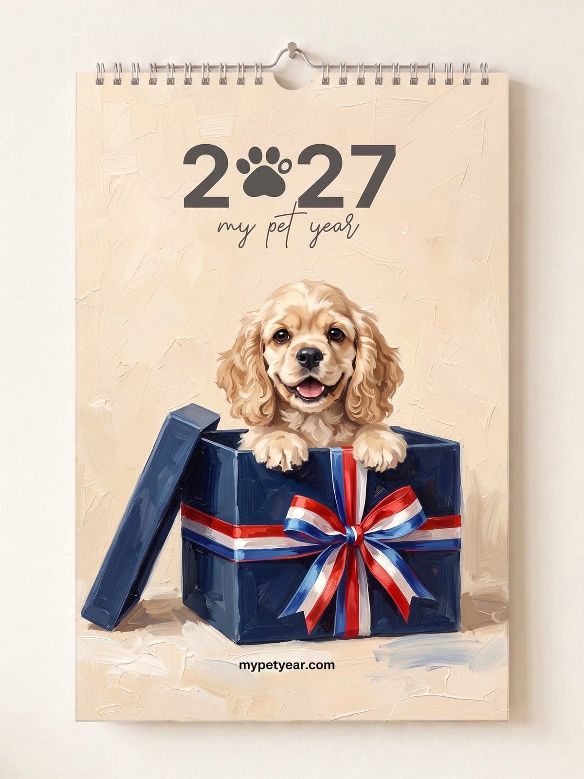 Painted Pet Calendar on a wall, cover with a cocker spaniel peeking out of a gift box