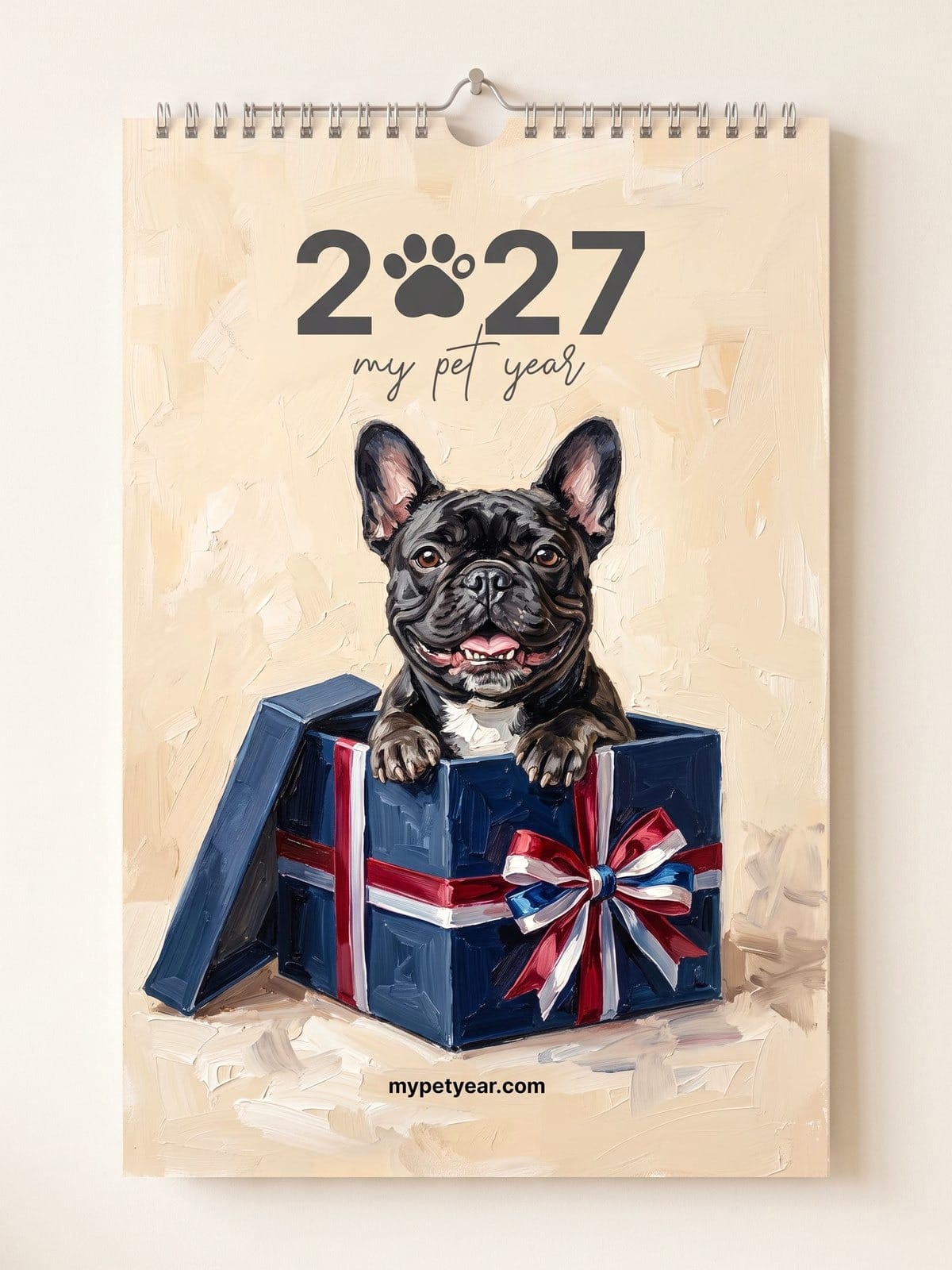 Painted Pet Calendar on a wall, cover with a French bulldog peeking out of a gift box