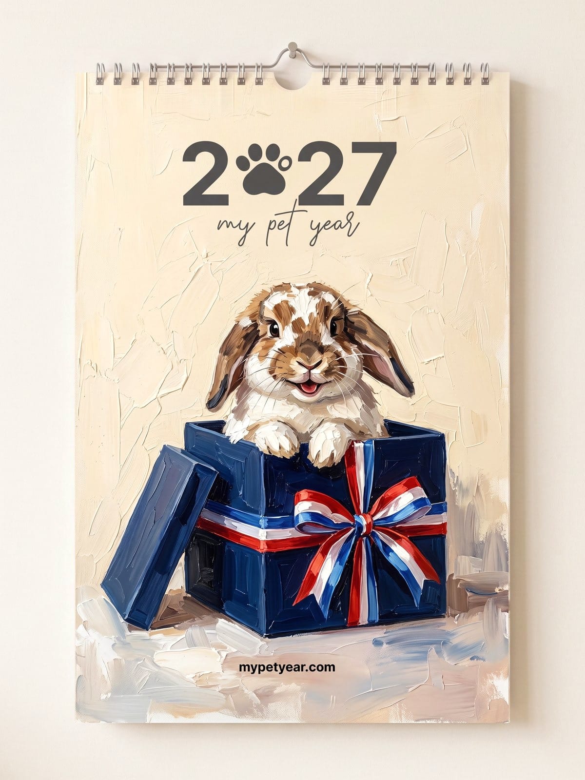 Painted Pet Calendar on a wall, cover with a lop-eared rabbit peeking out of a gift box