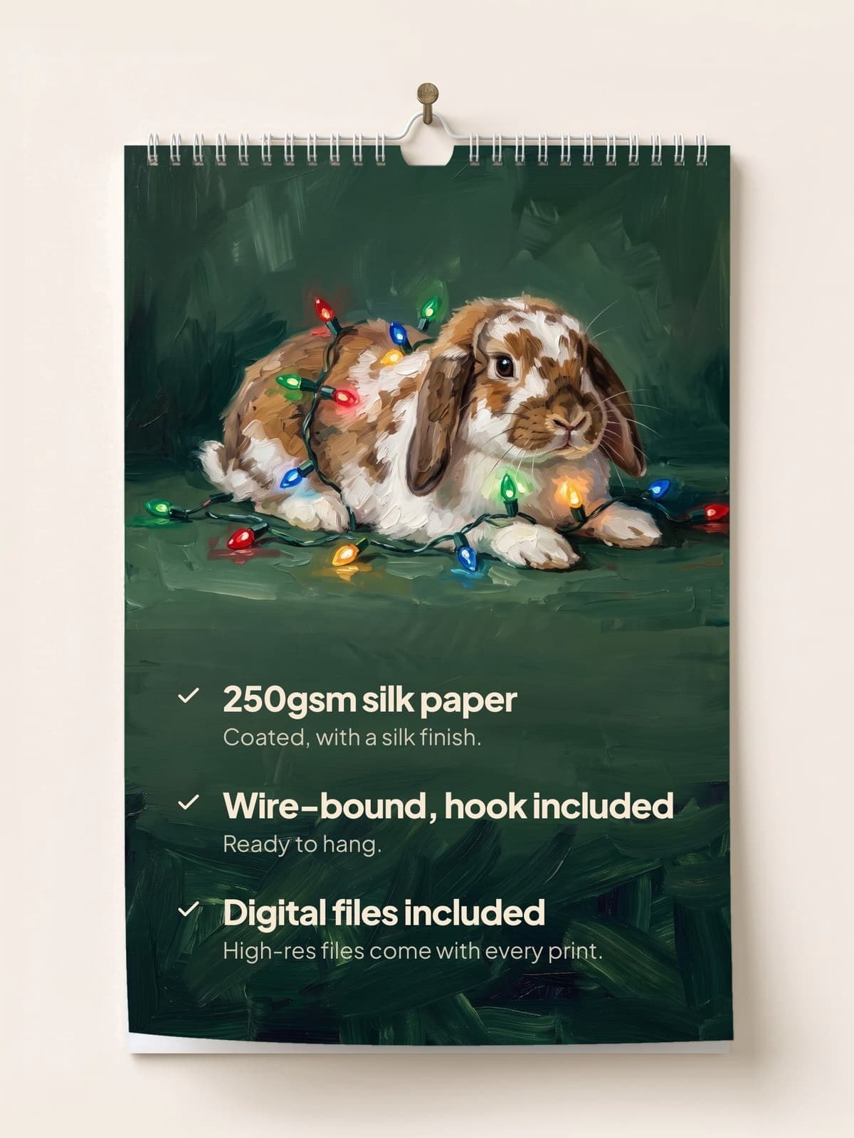 The painted calendar hanging on a wall: 250gsm silk paper, wire-bound with a hook, digital files included