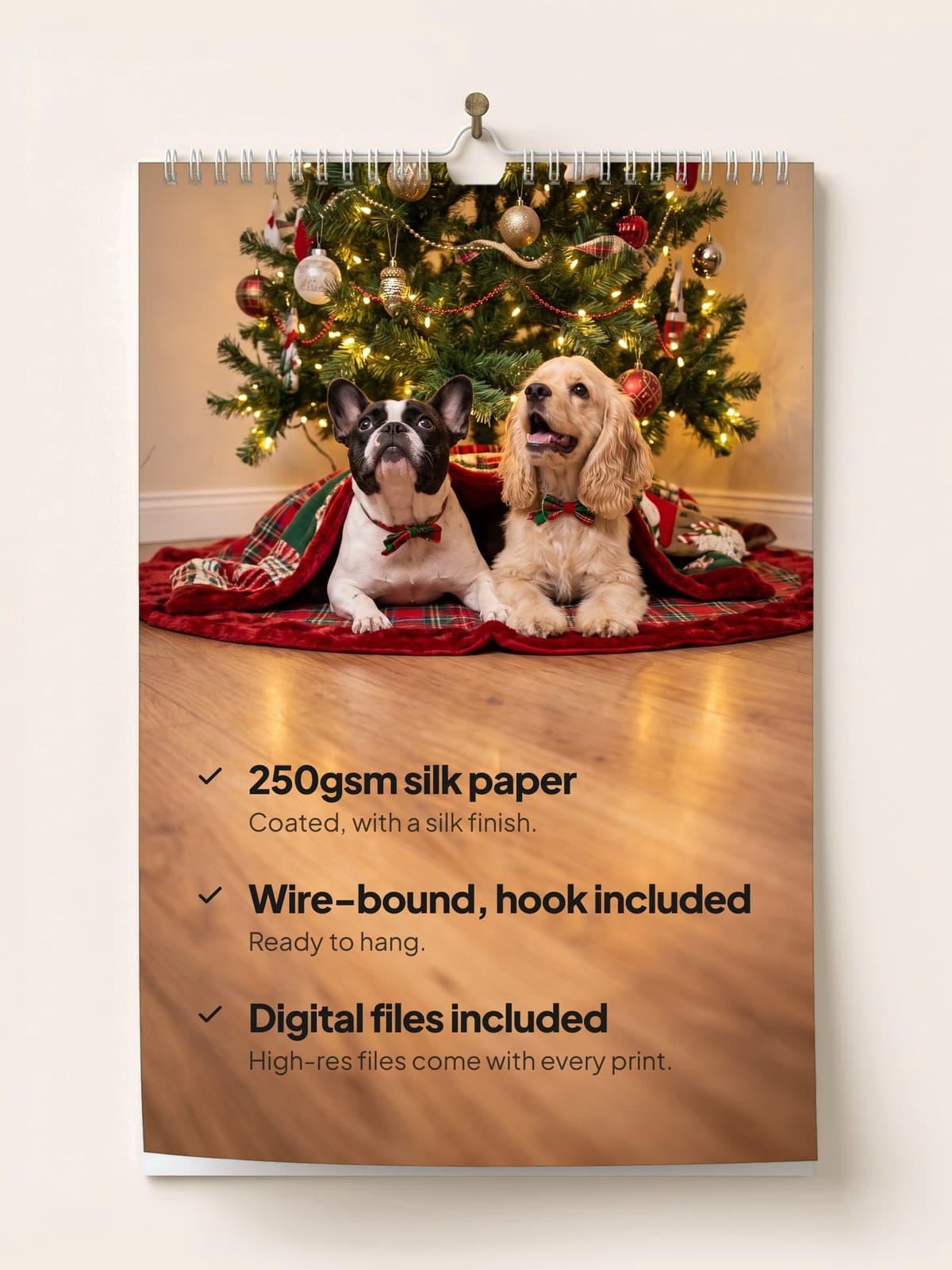 The calendar hanging on a wall: 250gsm silk paper, wire-bound with a hook, digital files included