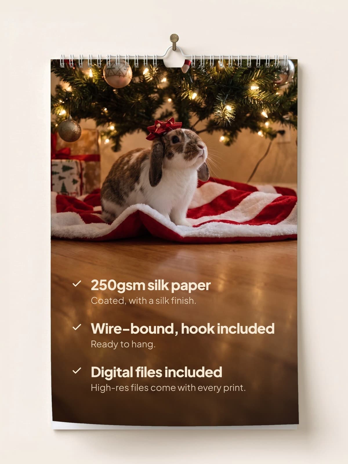 The calendar hanging on a wall: 250gsm silk paper, wire-bound with a hook, digital files included